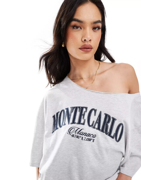 ASOS DESIGN relaxed off shoulder t-shirt with monte carlo graphic in green