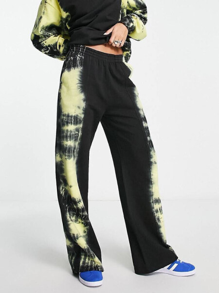 ASOS DESIGN oversized jogger with neon tiedye side detail in black