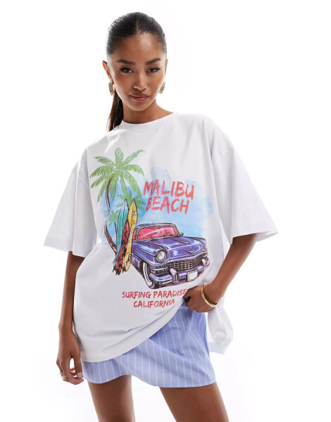 ASOS DESIGN oversized t-shirt with malibu beach graphic in white