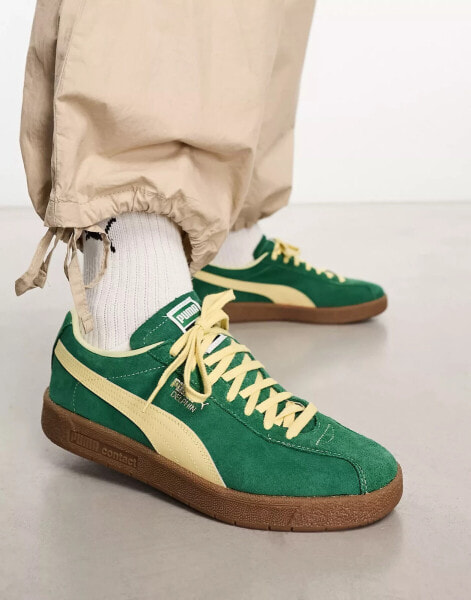 Puma Delphin trainers in green with gum sole