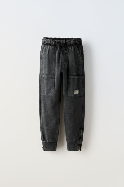 Plush trousers with zips