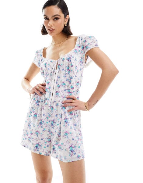 ASOS DESIGN dobby playsuit with corset waist in white ditsy print