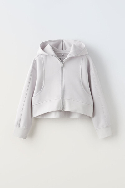 Sporty hooded jacket with shimmery trims
