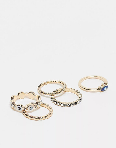 ASOS DESIGN pack of 5 rings with mixed eye design in gold tone