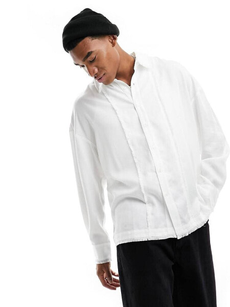 Reclaimed Vintage distressed long sleeve shirt in white with fraying detail