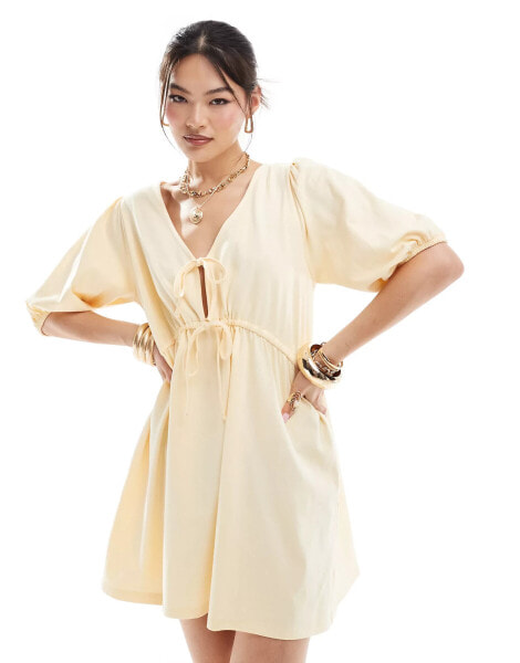 ASOS DESIGN puff sleeve with tie up bodice mini dress in buttermilk