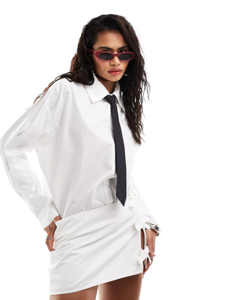 Lioness shirt with black tie co-ord in white