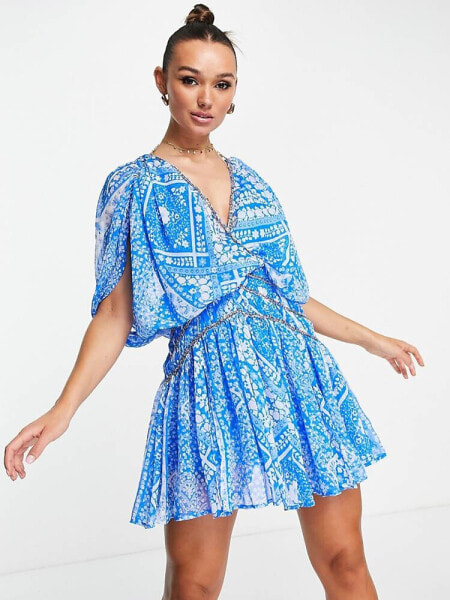 ASOS DESIGN blouson mini dress with chain strapping detail in blue floral