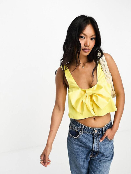 ASOS DESIGN structured satin cami with bow detail in yellow