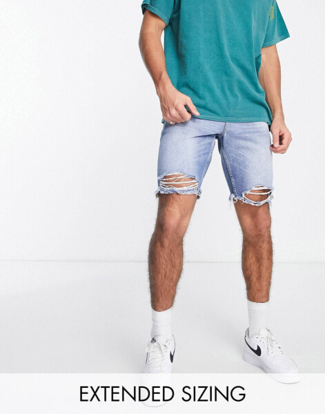 ASOS DESIGN slim regular length denim shorts with rip hem in light wash blue