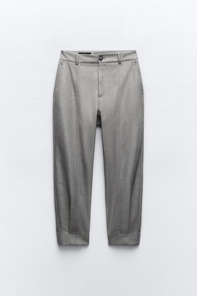 Carrot fit trousers with darted hems