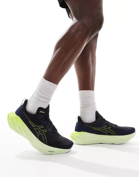 Asics Novablast 4 running trainers in black and neon yellow