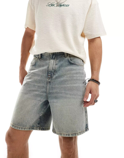 ASOS DESIGN standard length denim jorts in light wash blue