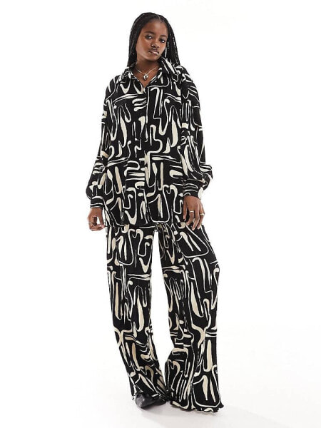 Extro & Vert plisse trousers in abstract print co-ord