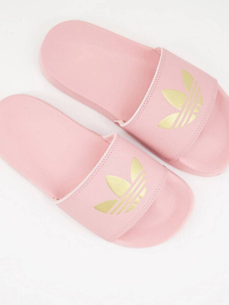 adidas Originals Adilette lite sliders in pink with gold trefoil