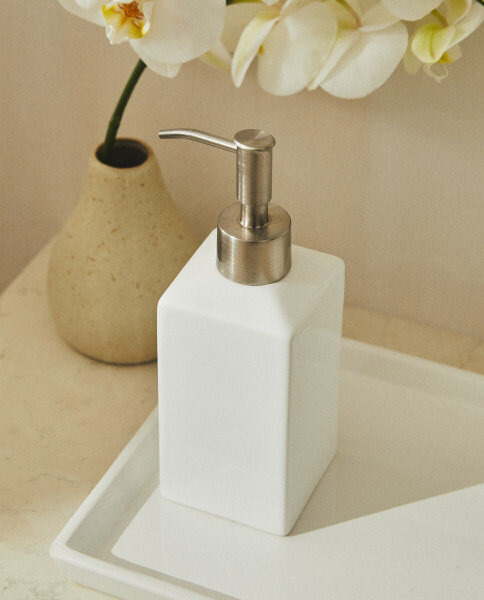 White earthenware bathroom soap dispenser