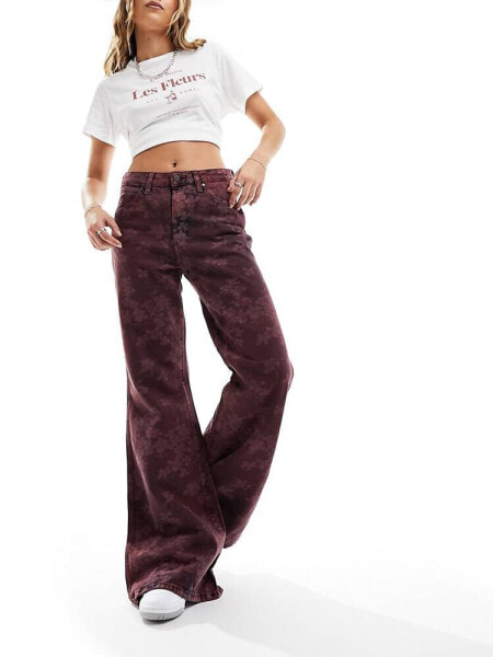 Wrangler flared jeans in burgundy floral