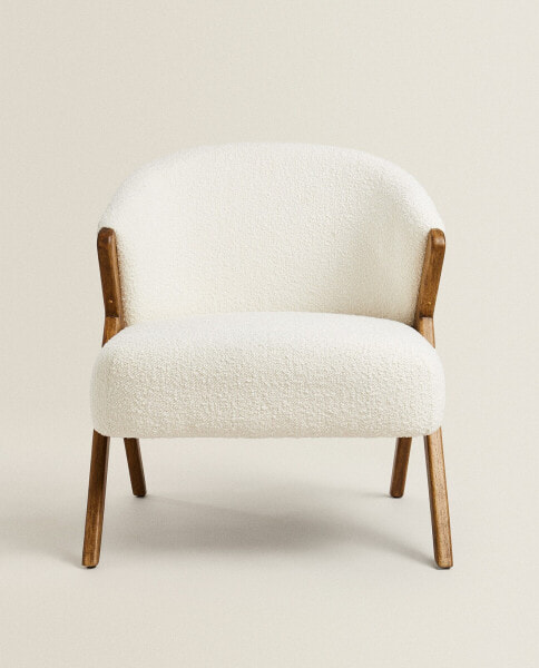 Upholstered bouclé armchair