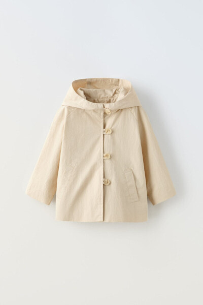 Hooded water-repellent buttoned parka