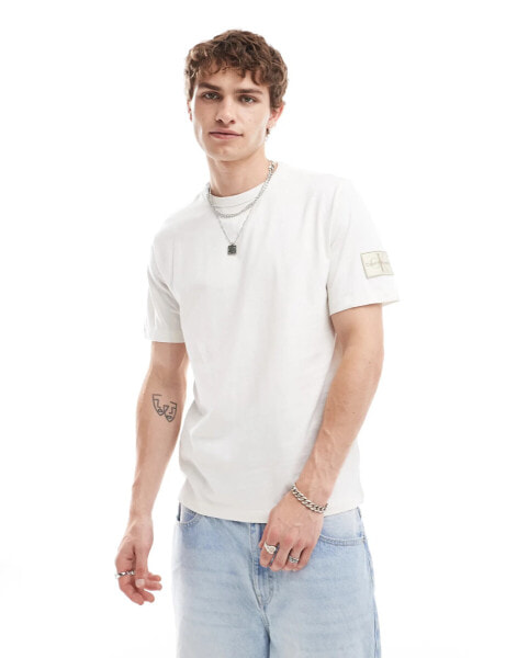 Calvin Klein Jeans badge t-shirt in off white