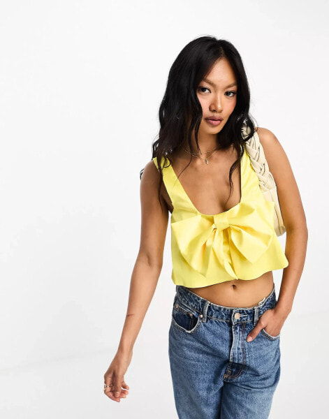 ASOS DESIGN structured satin cami with bow detail in yellow