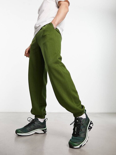 COLLUSION jogger with embroidered logo in dark green