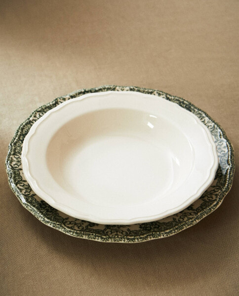 Earthenware soup plate with raised-design edge