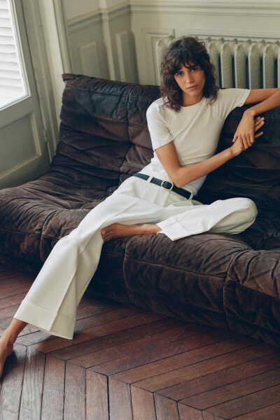 Belted trousers with turn-up hems