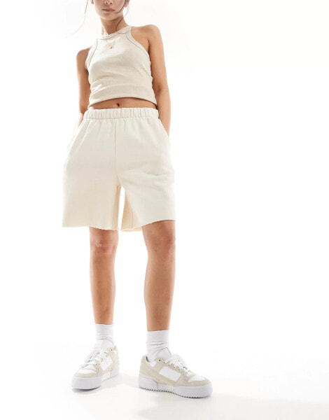 ASOS DESIGN raw hem longline shorts in cream