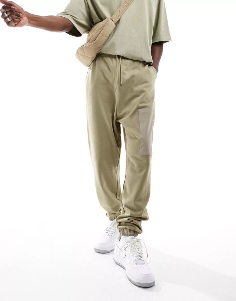 ASOS DESIGN tapered joggers with nylon pocket in beige