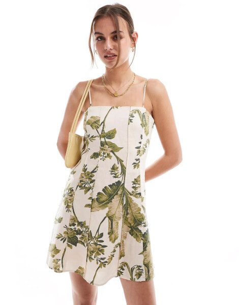 & Other Stories linen mini flippy dress with adjustable straps and panelled seams in botanical leaf print