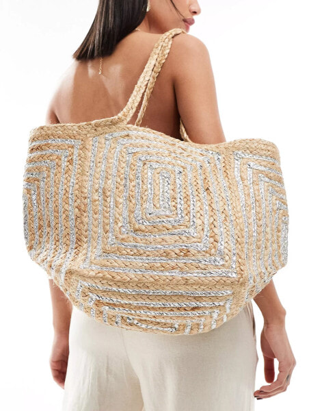 Accessorize straw tote with silver detail in beige