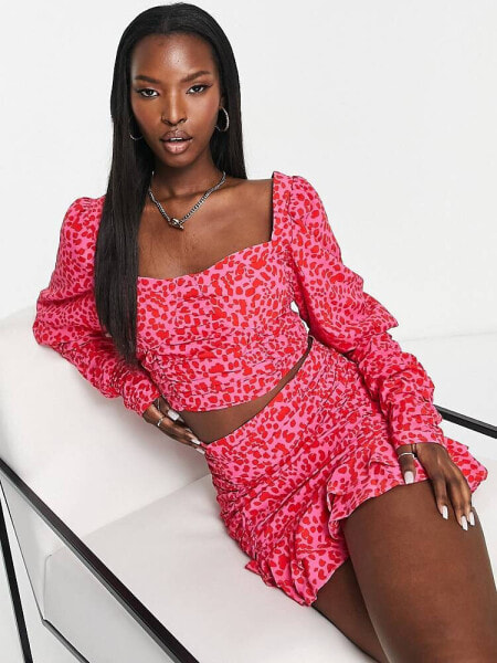 Collective the Label exclusive bow back crop top co-ord in pink and red leopard print 