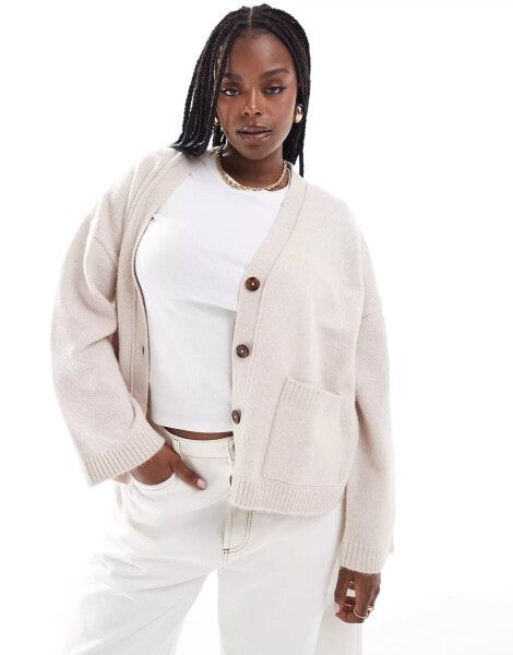 ASOS DESIGN Curve boxy cardigan with v neck and pocket detail in cream