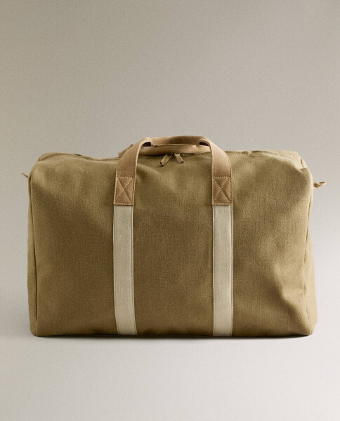 Fabric suitcase with leather detail