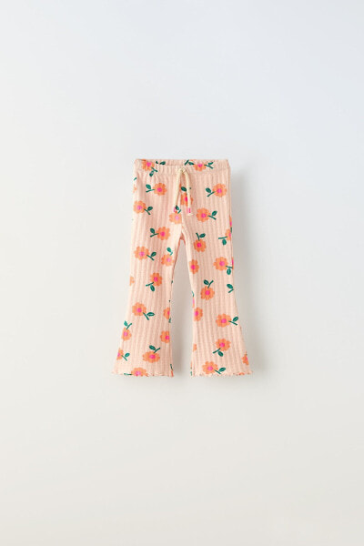 Open knit floral flared leggings