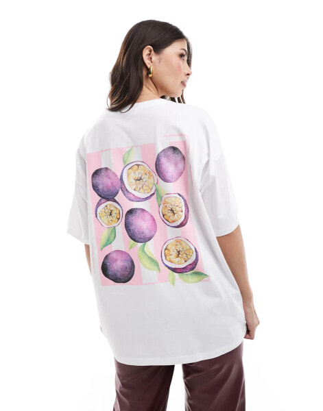 ASOS DESIGN oversized t-shirt with painterly passion fruit graphic in black