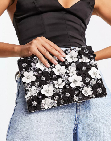 ASOS DESIGN clutch bag with 3D flowers in black