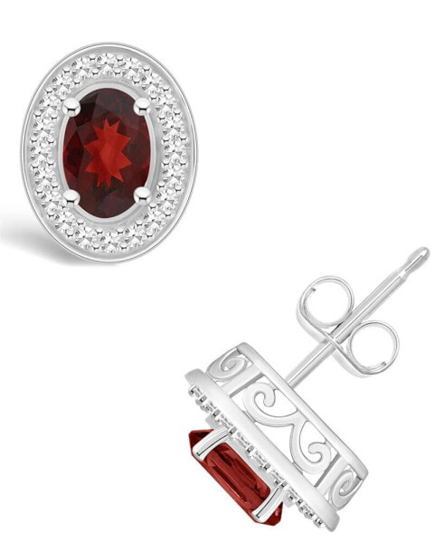 Garnet (1-1/6 ct. t.w.) and Diamond (1/5 ct. t.w.) Halo Studs in Sterling Silver