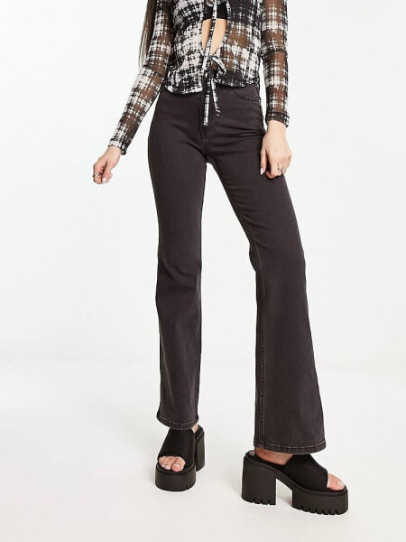 Weekday Glow high waist flared stretch jeans in black lux