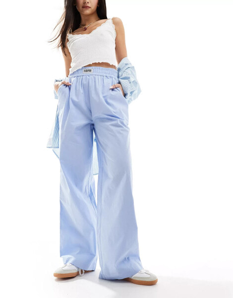 ASOS Weekend Collective woven trousers with label in blue poplin