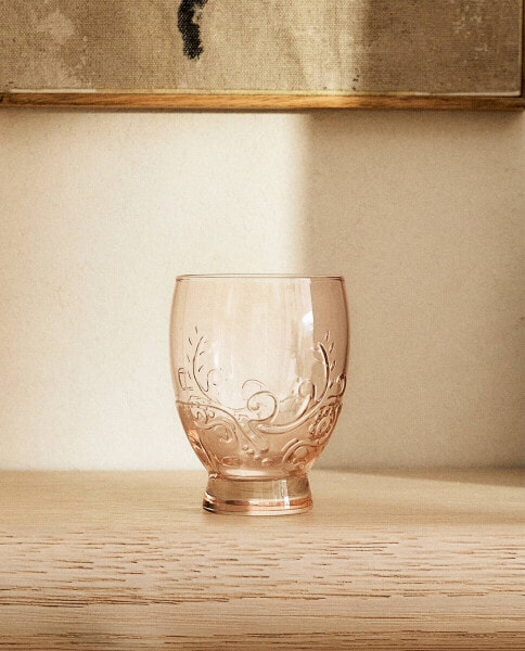 Raised design glass tumbler