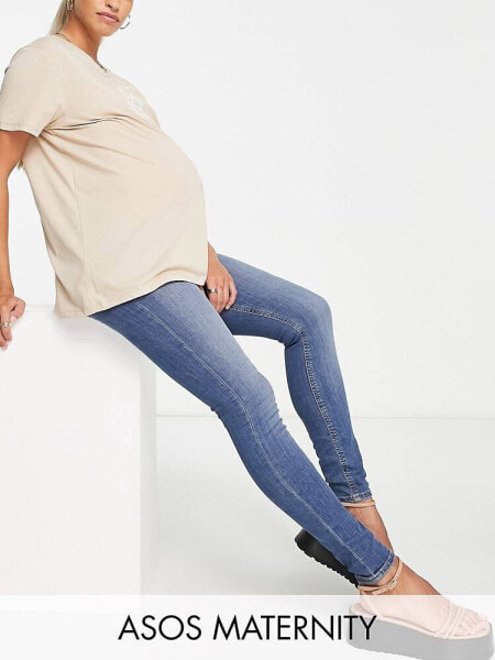 ASOS DESIGN Maternity ultimate skinny jeans in authentic mid blue with under the bump waistband 