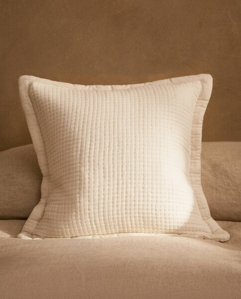 Muslin cushion cover with piping