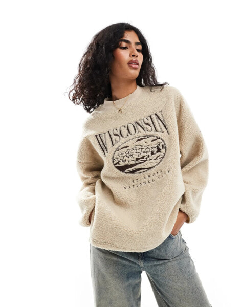 ASOS DESIGN wisconsin embroidered borg sweat