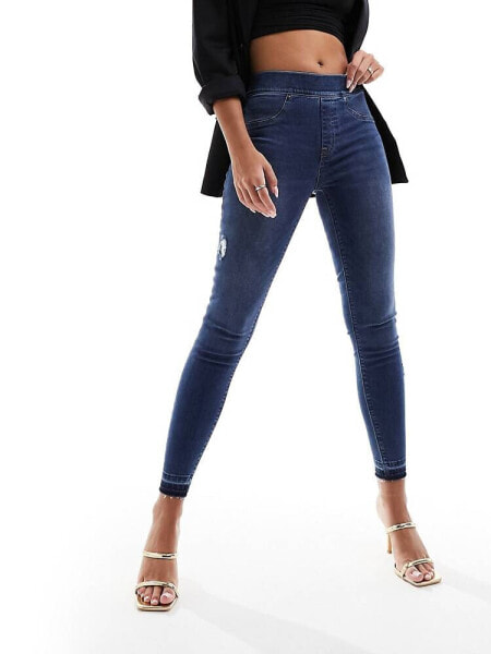 Spanx shape and lift distressed skinny jeans in medium wash blue