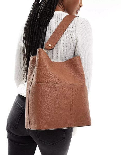 Accessorize bucket bag with faux suede in tan