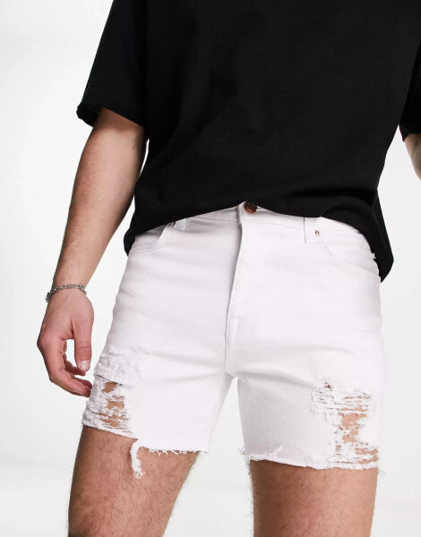 ASOS DESIGN shorter length denim shorts with rips in white