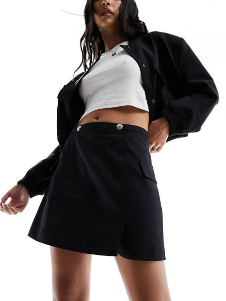 Morgan aline mini skirt with hardwear detail in black