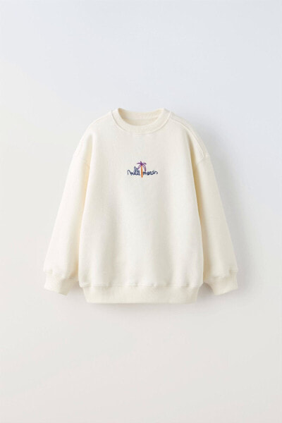 Sweatshirt with embroidered slogan